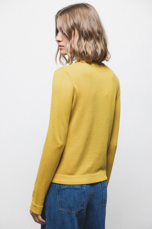 Maglione in maglia rasata con scollo a V e fiocco