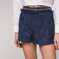 Shorts effetto tweed con catena