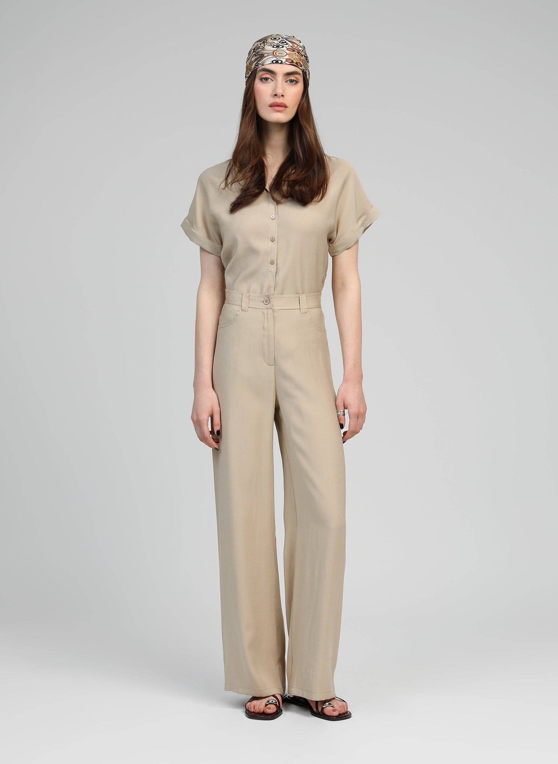 Pantaloni a zampa beige a vita alta