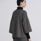 Felpa in maglia a micro quadretti con scollo a V