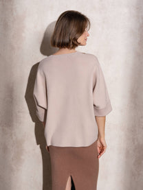 Maglia ampia in maglia con bottoni sulle maniche