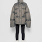 Piumino oversize con collo alto color pietra