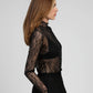 Top in pizzo trasparente nero a maniche lunghe con collo alto