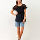 Top t-shirt nero in tulle plumetis con balze