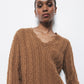 Maglione in lana a trecce con scollo a V