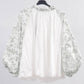 Blusa floreale con maniche a sbuffo