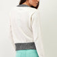 Maglia in cotone con paillettes e scritta