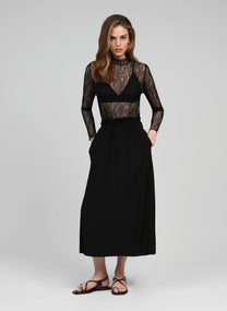Top in pizzo trasparente nero a maniche lunghe con collo alto