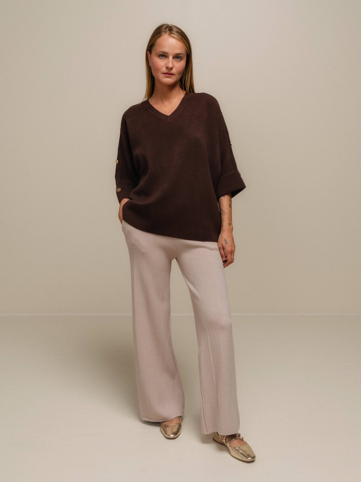 Pantaloni a zampa beige da donna