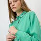 Camicia verde con dettagli gioiello