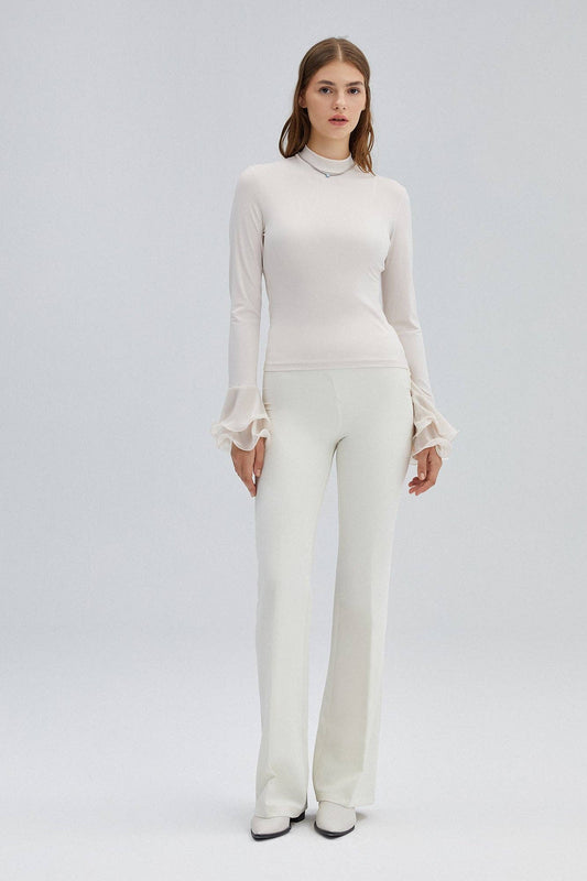 Blusa in maglia ecrù con maniche a balze in chiffon