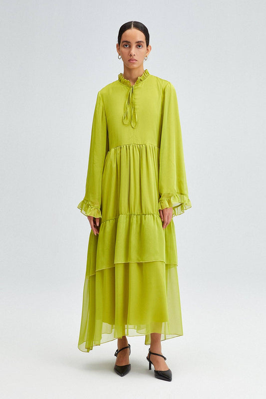 Abito lungo in chiffon con balze e fiocco al collo