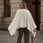 Poncho in lana con bordatura a contrasto