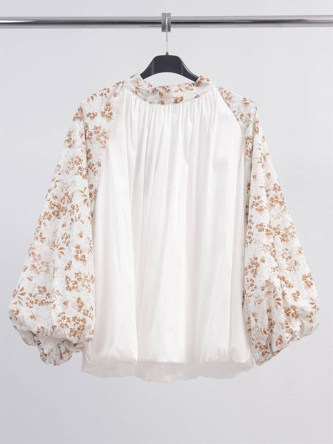 Blusa floreale con maniche a sbuffo