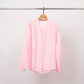 Blusa testurizzata con bottoni e scollo a V