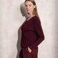 Maglione in maglia scintillante con profilo ondulato