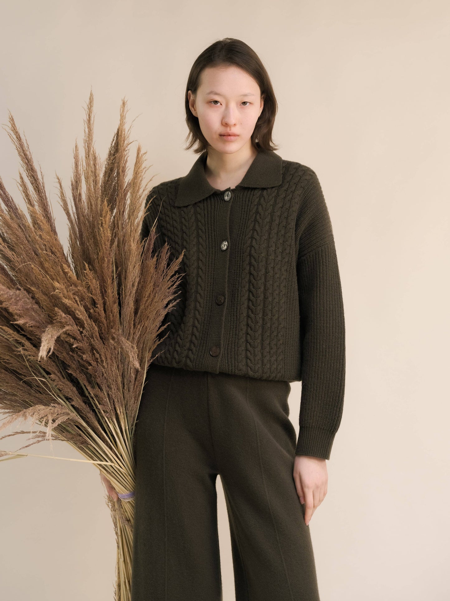 Cardigan polo in misto cashmere con trecce