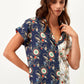 Blusa stampata bicolor con scollo a V
