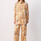 Completo boho con camicia stampata e pantaloni palazzo