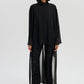 Tunica nera in chiffon con collo in velluto