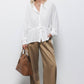 Blusa bianca con coulisse in vita