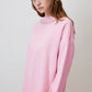 Maglione rosa con collo decorato in perle