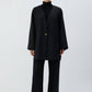 Giacca nera oversize con scollo a V e bottone