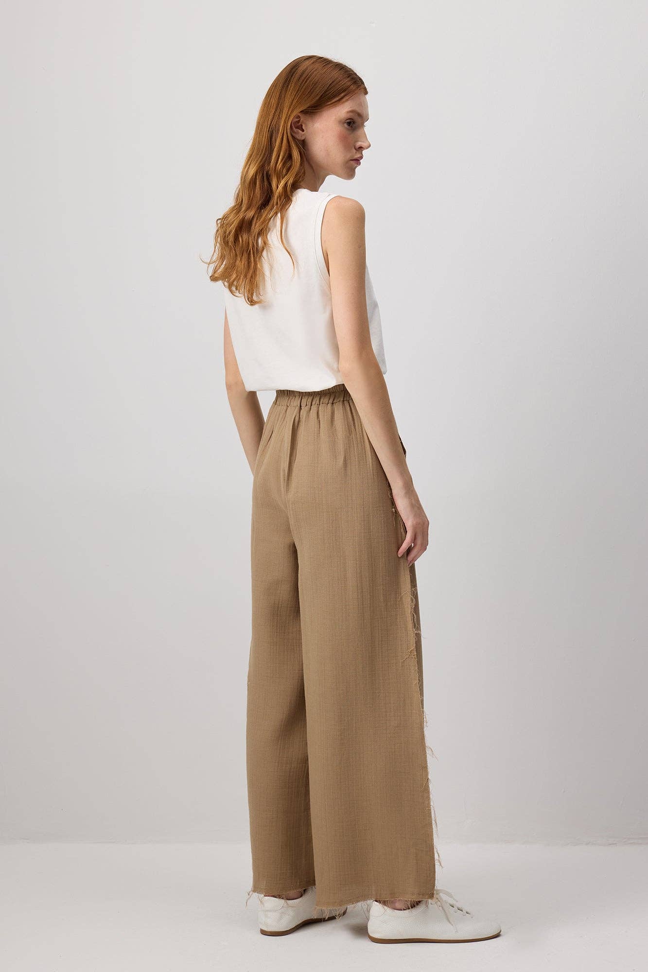 Pantaloni palazzo in cotone con bordi sfrangiati