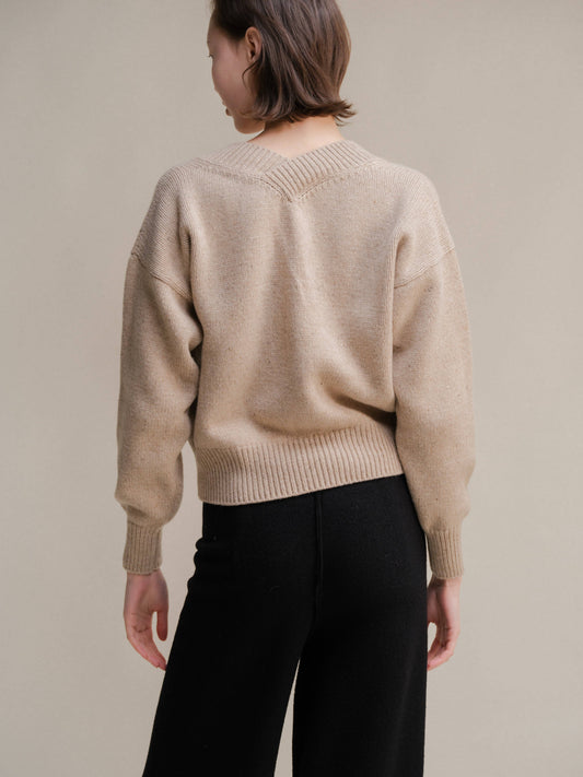 Maglione corto tweed con doppio scollo a V