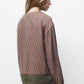 Blusa geometrica con scollo a V