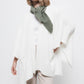 Cardigan mantella in maglia con tasche