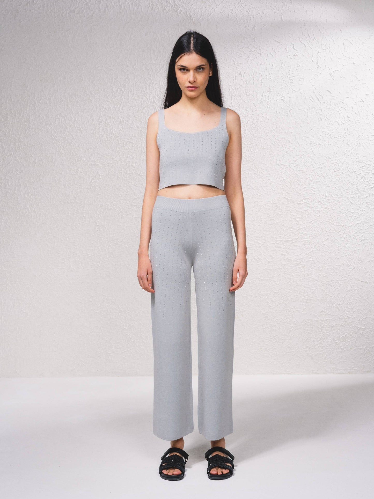 Pantaloni in maglia a gamba ampia con applicazioni glitter