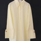 Camicia in popeline giallo burro con polsini oversize