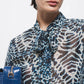 Blusa stampata con fiocco al collo