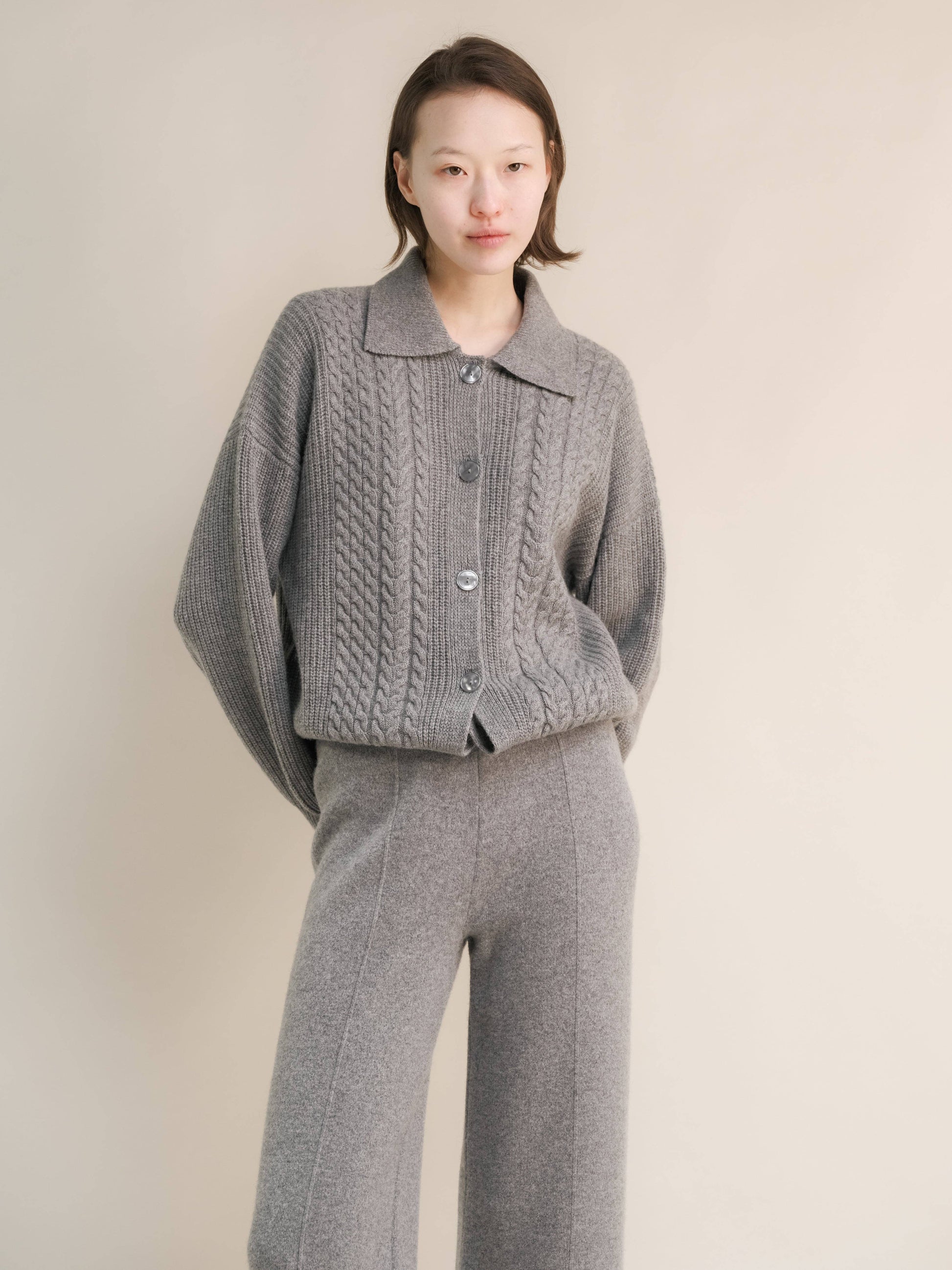 Cardigan polo in misto cashmere con trecce