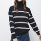 Maglione a righe in maglia con collo alto