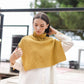 Poncho maglione in maglia a coste con collo alto