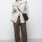Cardigan a costine con collo ampio