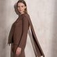 Maglione in maglia con sciarpa abbinata