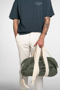 Borsa Aviator verde in cotone con patch e tracolla regolabile
