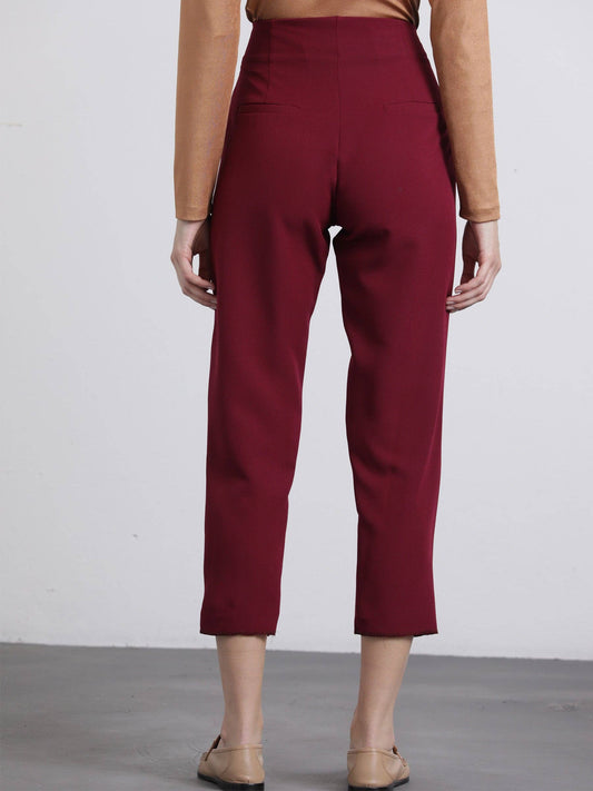 Pantaloni cropped bordeaux con bottoni dorati