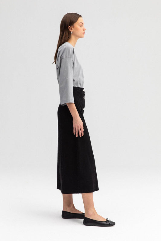 Gonna jeans a linea midi nera con bottoni