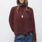 Blusa tinta unita con collo alto