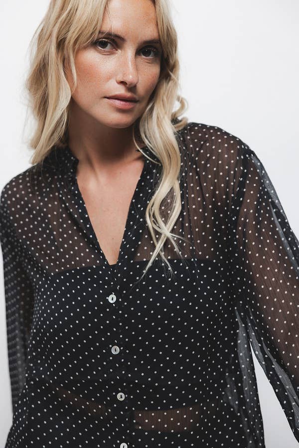 Blusa a pois semitrasparente con scollo a V