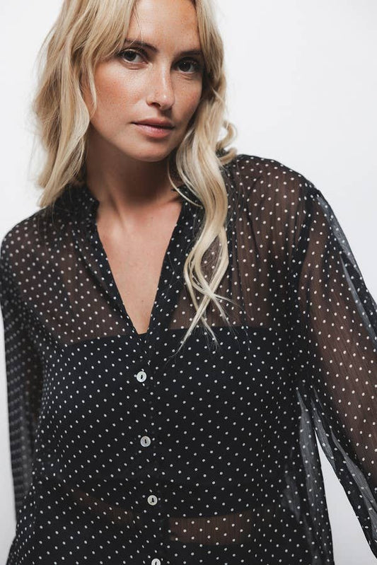 Blusa a pois semitrasparente con scollo a V