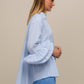 Blusa a righe con volant rinforzati
