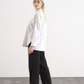 Camicia bianca in cotone con bottone a cuore