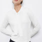 Maglione in maglia rasata con scollo a V e fiocco