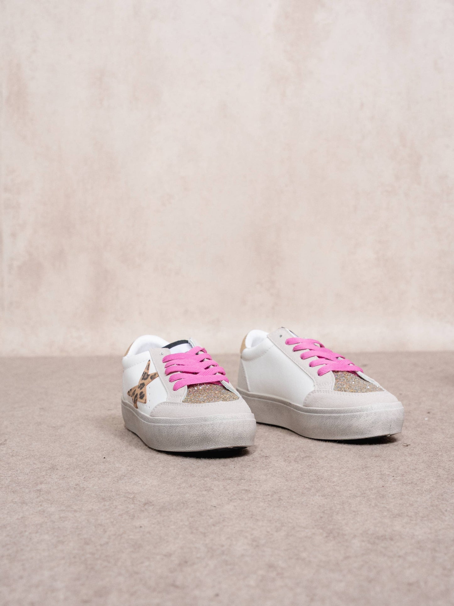 Sneakers platform con stella animalier e glitter