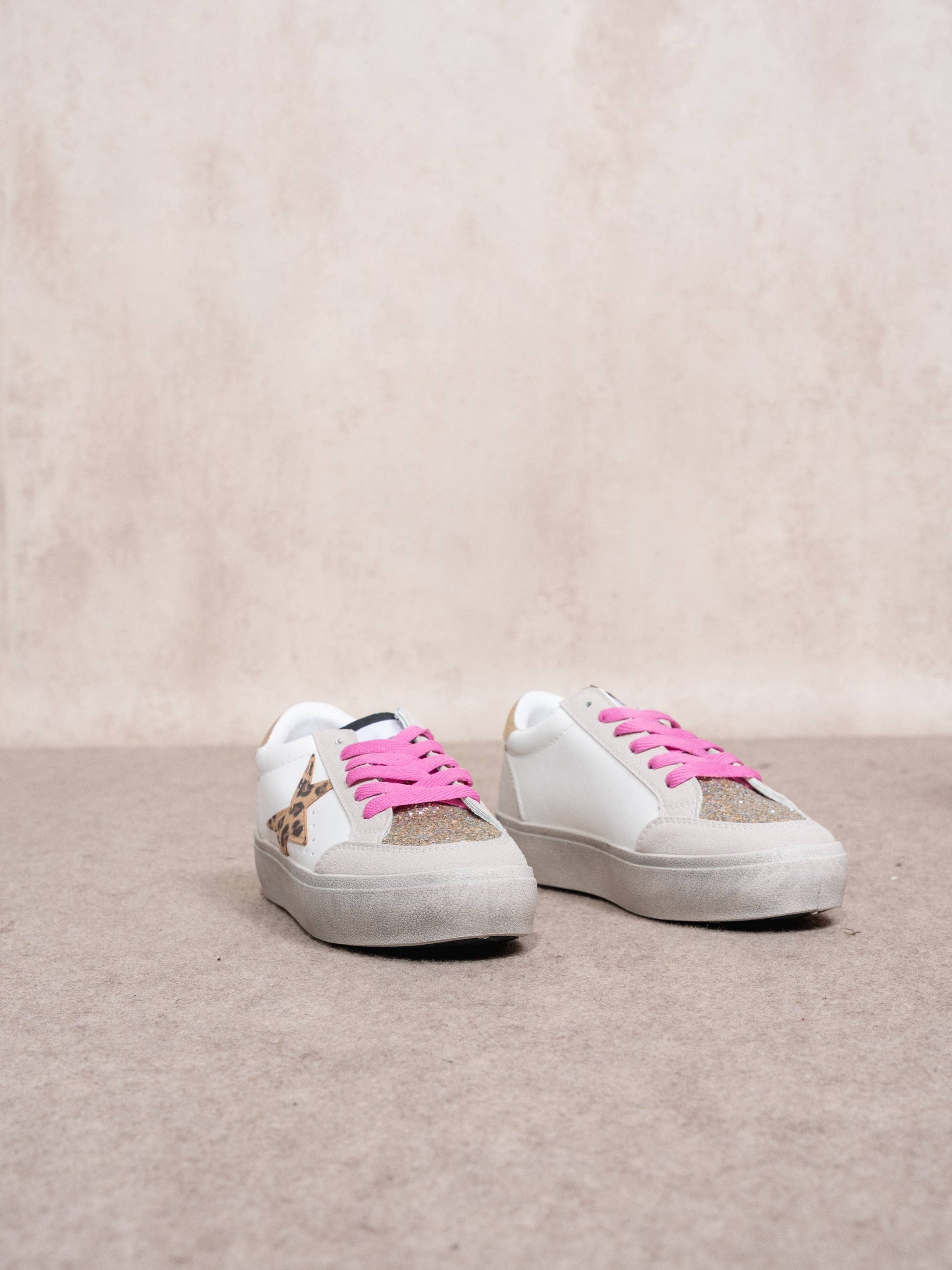 Sneakers platform con stella animalier e glitter